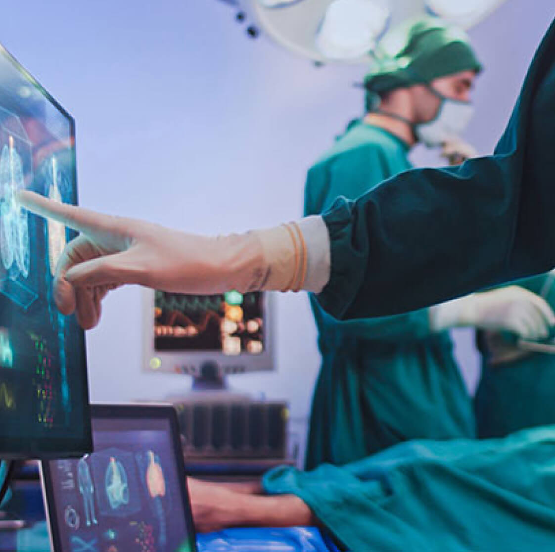 Doctor touching screen in operating room